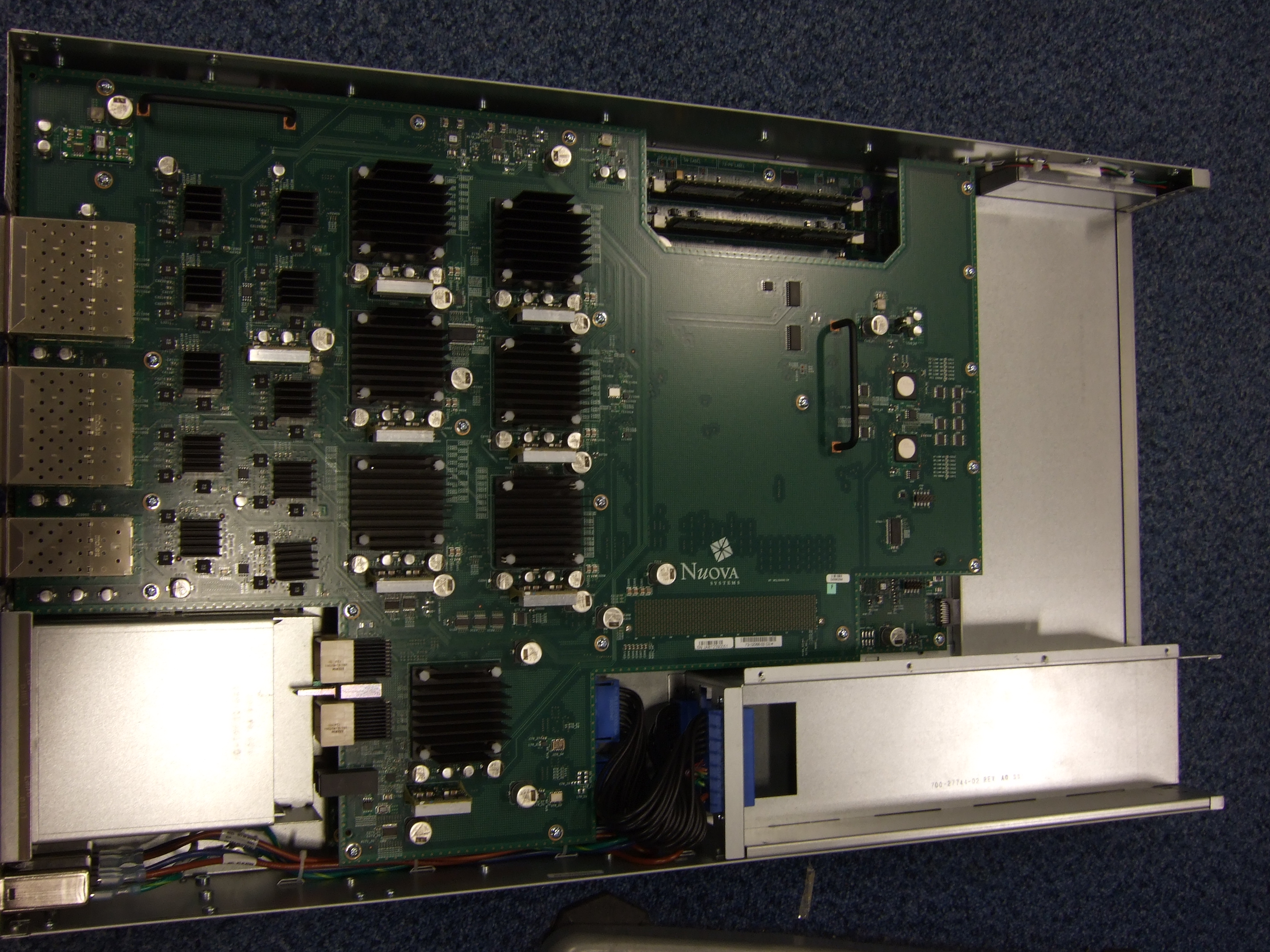 Nexus 5020 - ports at left, PSU slots at bottom. Top motherboard visible